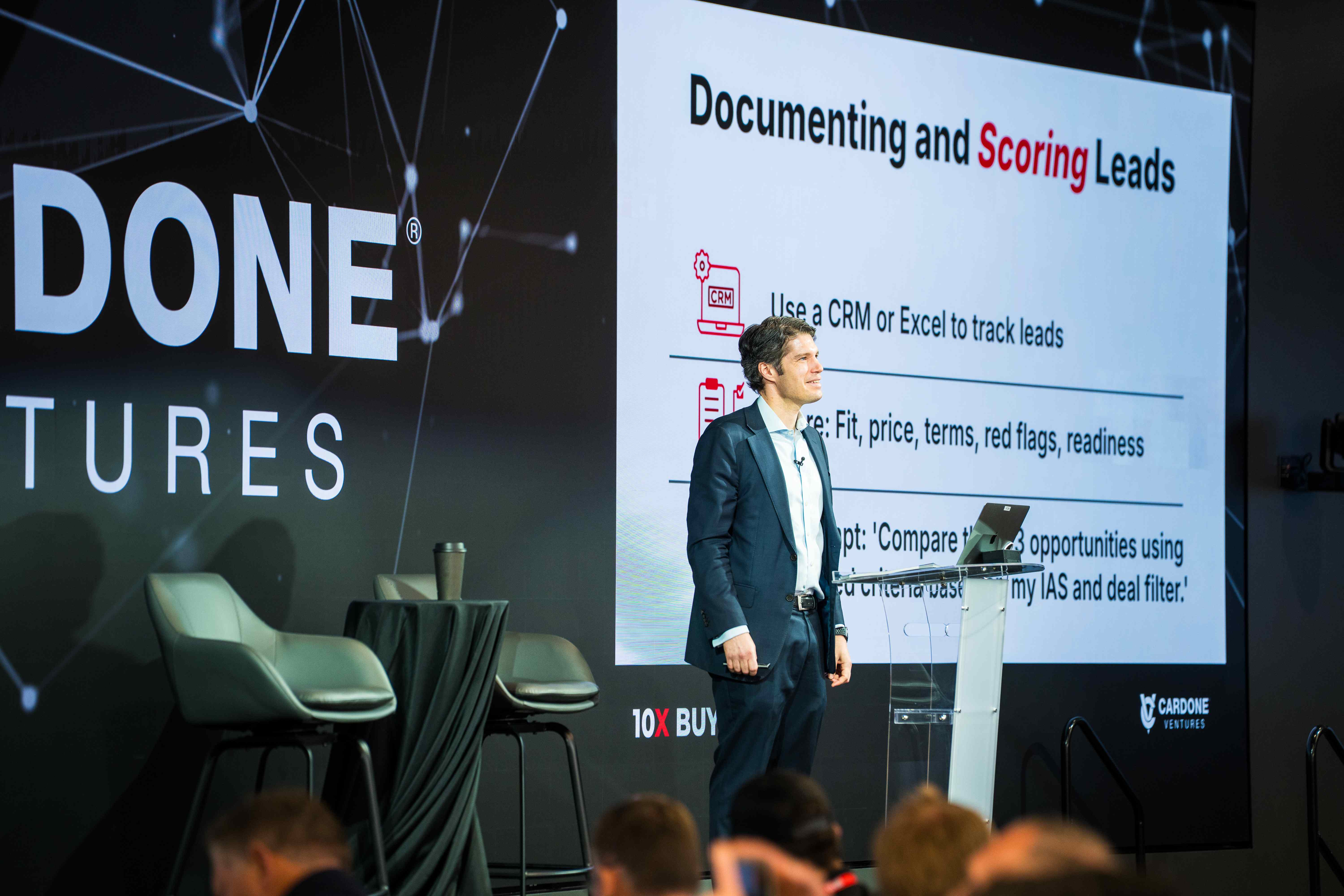 Presenter teaching deal scoring strategies on stage